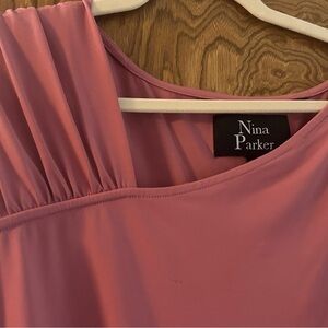 Nina Parker Pink long sleeve bodysuit top. can be worn on a XL/3XL.